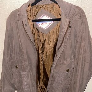 Olive / Dark green jacket.